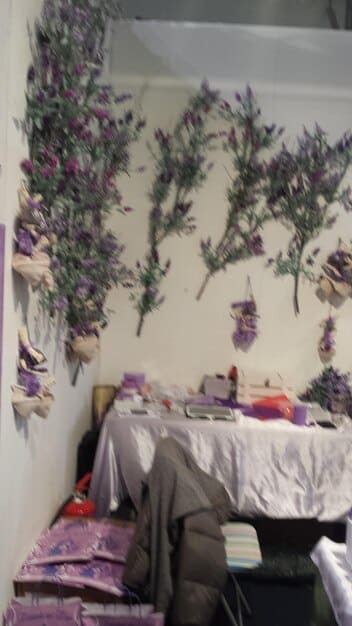 A cozy bedroom corner featuring DIY home decor projects using Shein items, such as custom-painted cushion covers, a creatively framed poster, and upcycled storage baskets, showcasing personalized, budget-friendly design.