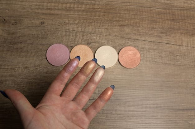 A hand swatching different colors from a Shein eyeshadow palette with a range of matte and shimmer shades on fair skin.